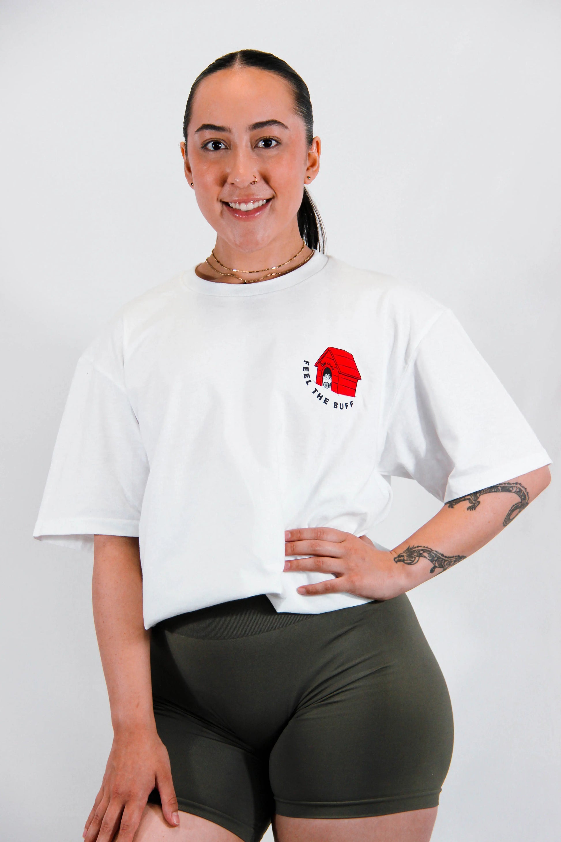 Front view of a model wearing the Classic Buff Tee, featuring the dog house graphic that complements the Scoopy design on the back.